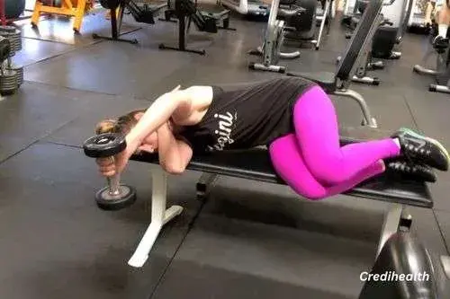 Side dumbbell lifts for rear delts